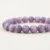 Close-up of Kunzite Energy Bracelet showing natural purple veining in round polished crystal beads.