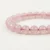 Close-up of Rose Quartz Energy Bracelet showing smooth polished pink crystal beads with natural clarity.